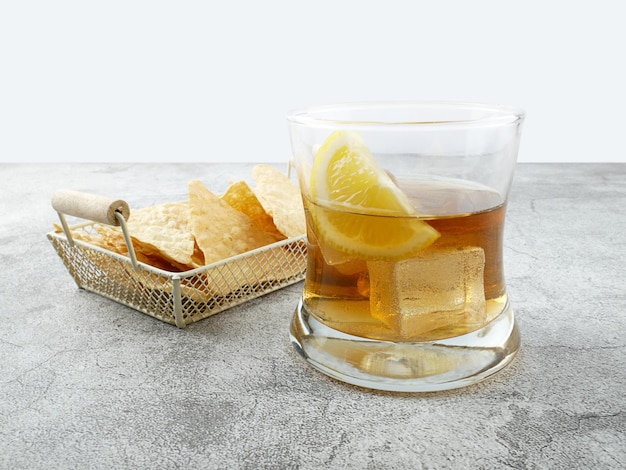 Cola drink with lemon and snack