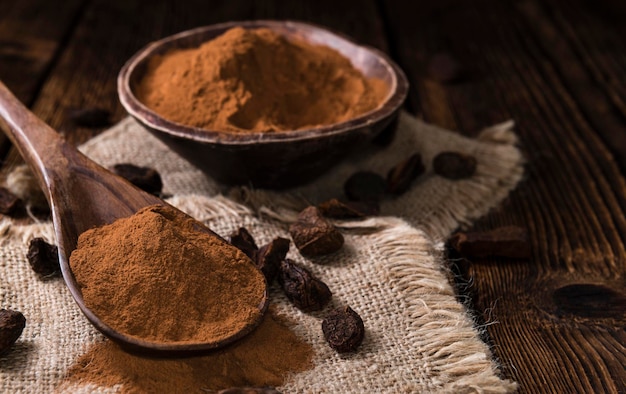 Cola Nut Powder on wooden background