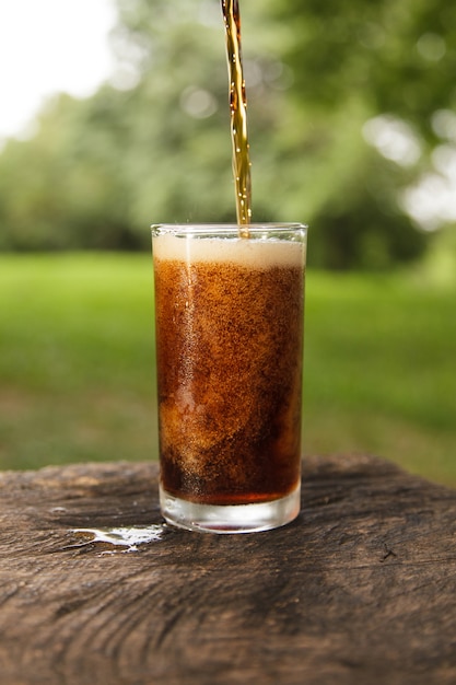 Cola pouring in a glass 