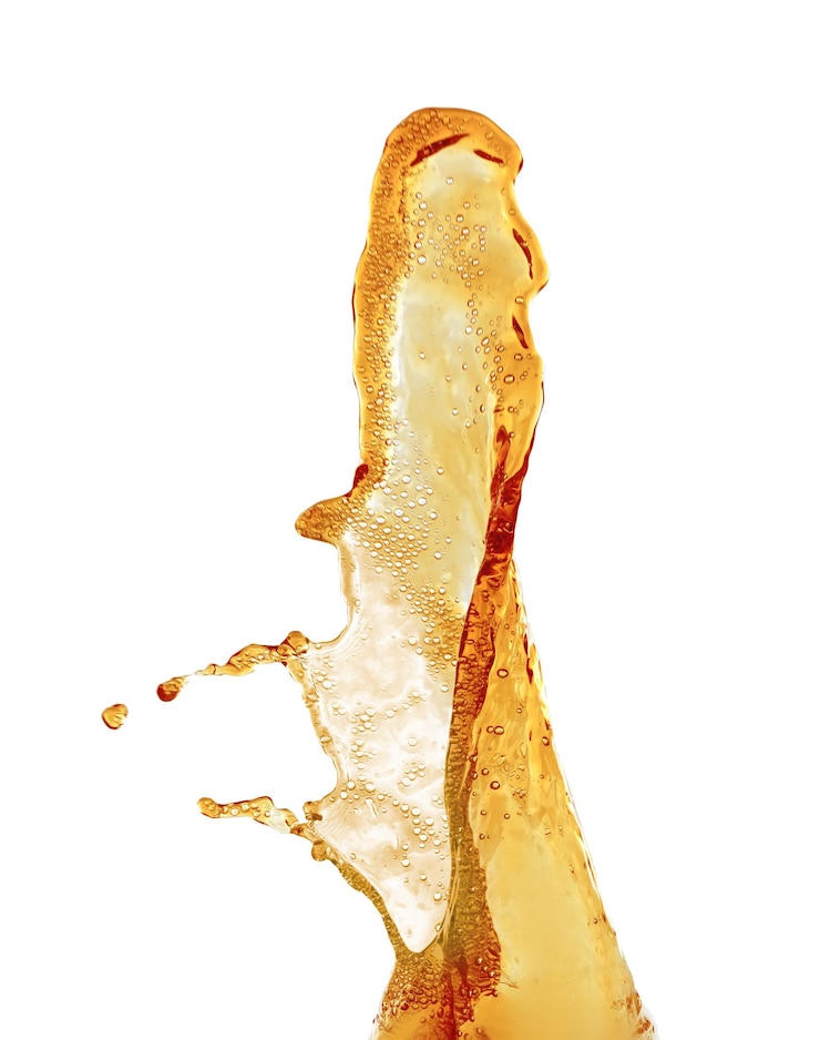Photo cola splash on white background
