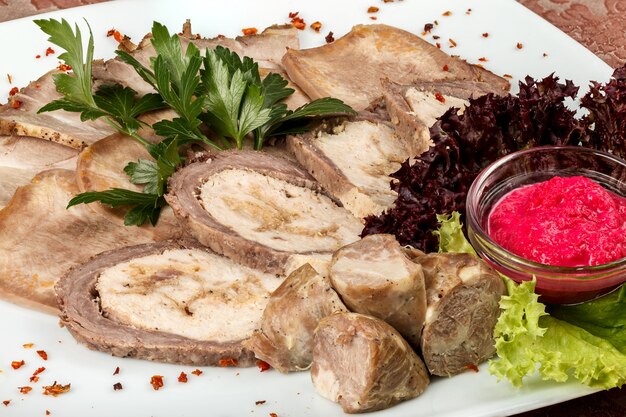 Cold appetizer of meat products with horseradish