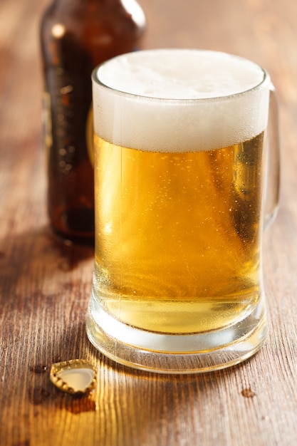 Cold beer glass on bar or pub desk