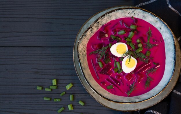 Cold beetroot soup with vegetables eggs and herbs Healthy food rich in fiber and vitamins