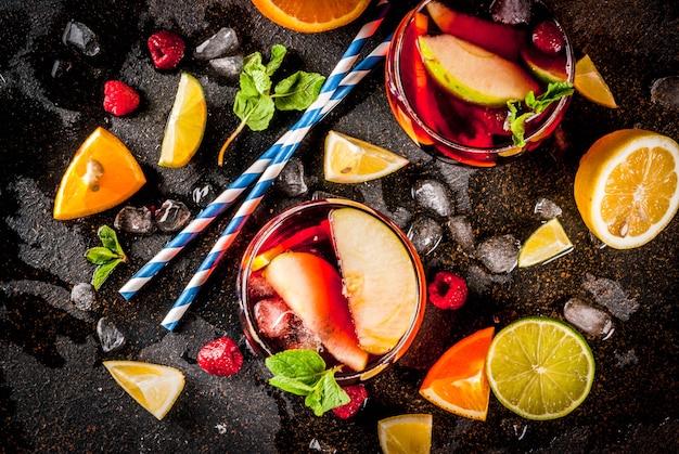  cold cocktail, fruit and berry white sangria with various fruits