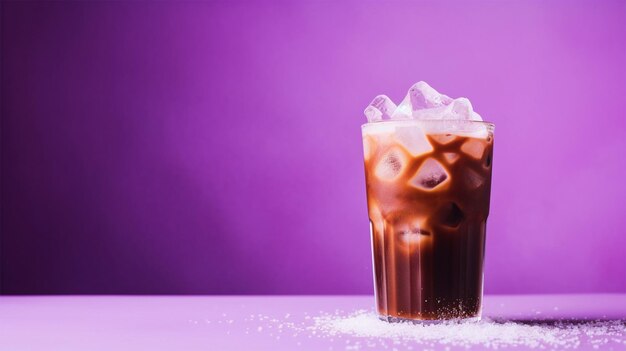 Cold coffee in glass on isolated purple background