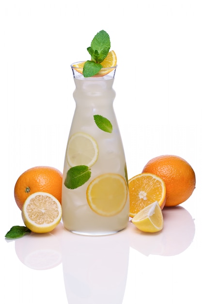 Cold drink with orange, lime and pepper mint