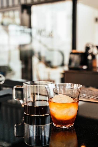 Cold drip arabica black coffee in glass with ice ball