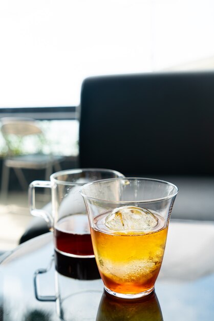 cold drip arabica black coffee in glass with ice ball