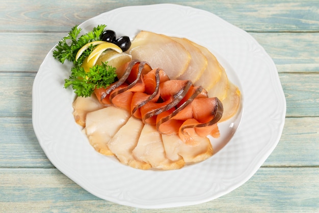 Cold fish plate. Set of appetizers on wooden table