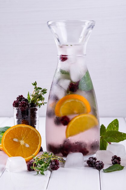 Cold fresh  homemade  lemonade with blackberry and herbs. Detox soda water recipe