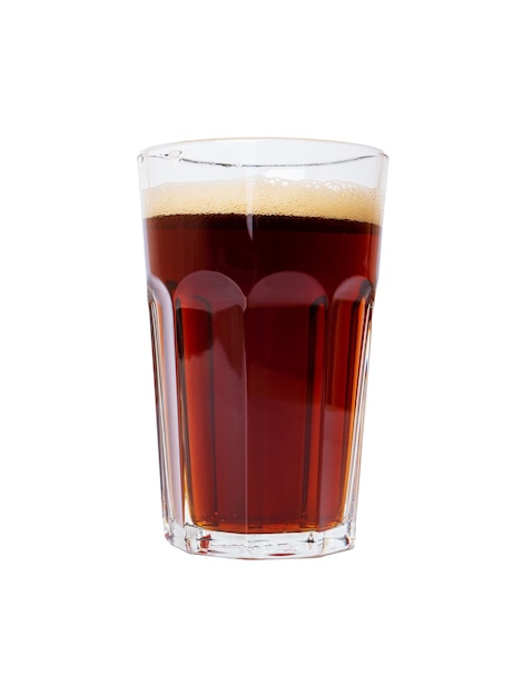 Cold glass of dark beer or kvass with foam in a glass isolated on white background