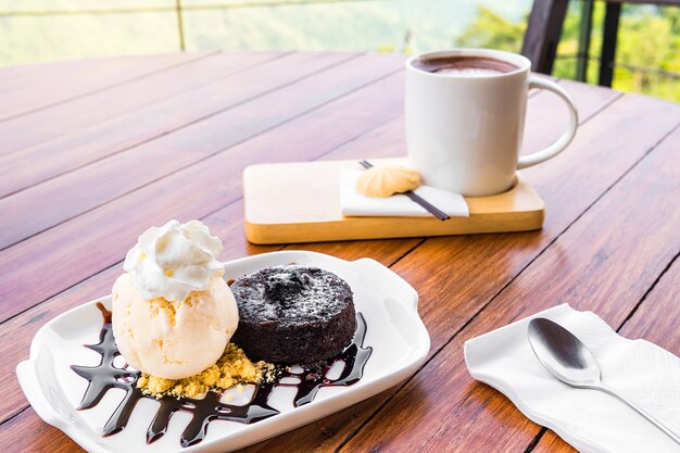 Cold ice cream served with a delicious cake and coffee ready to eat.