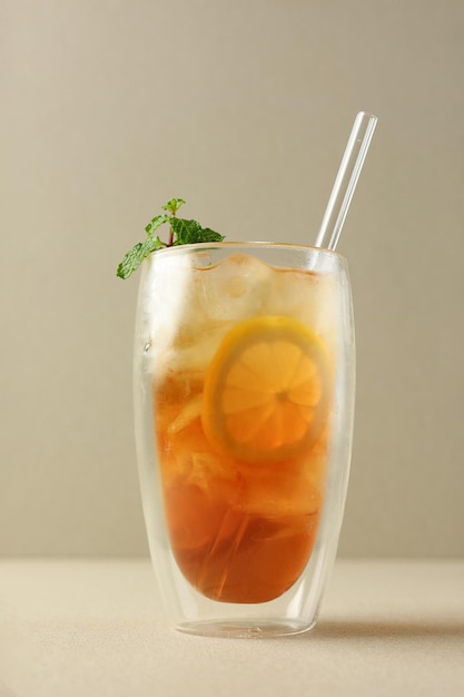 Cold Lemon Tea on Tall Double Wall Glass