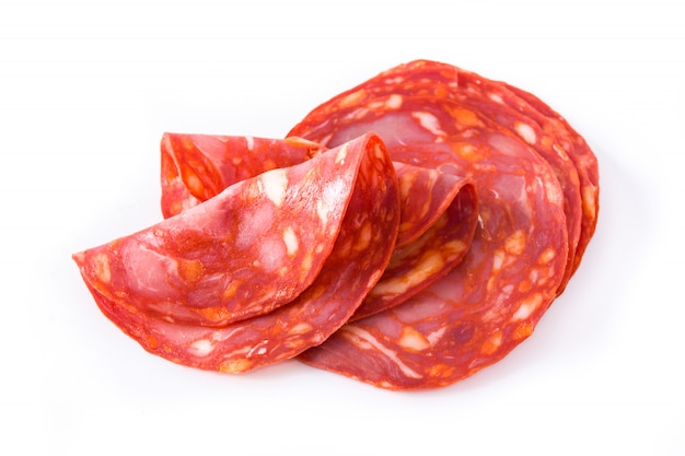 Cold meat chorizo slices on white surface