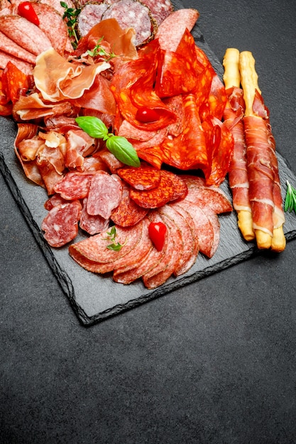 Cold meat plate with salami and chorizo sausage and parma