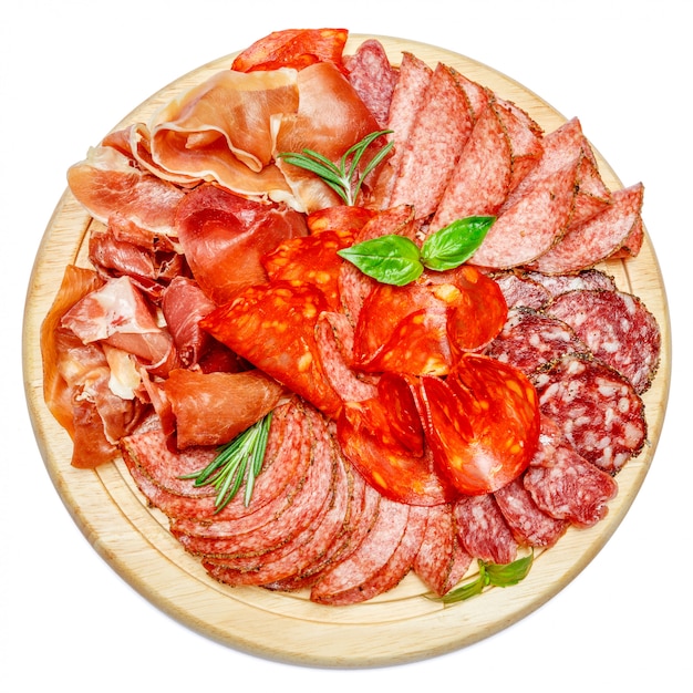 Cold meat plate with salami and chorizo sausage on wooden board