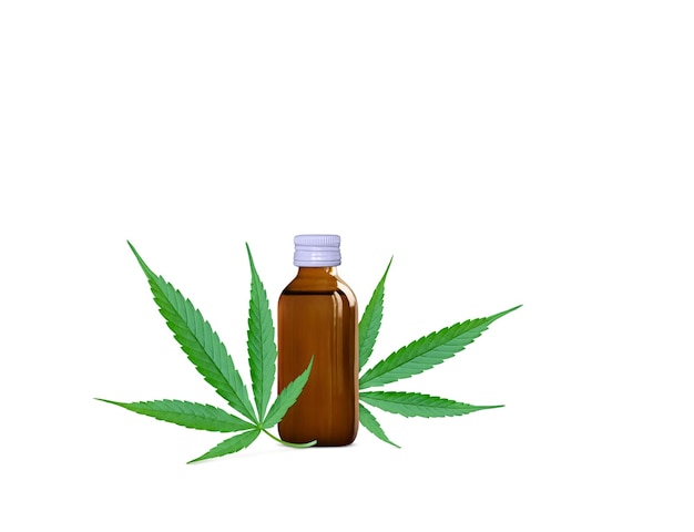 Cold pressed cannabis in jar with fresh cannabis leaves isolated on white background