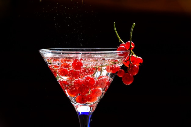 Cold red cocktail with red currant