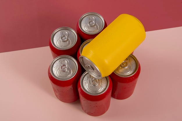 Cold red soda cans with a yellow one for conceptual use