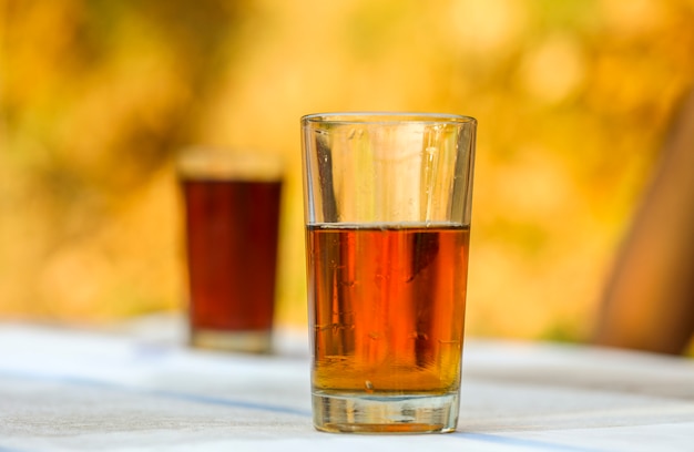 The Cold Soft Drink in Glass on Bright Background