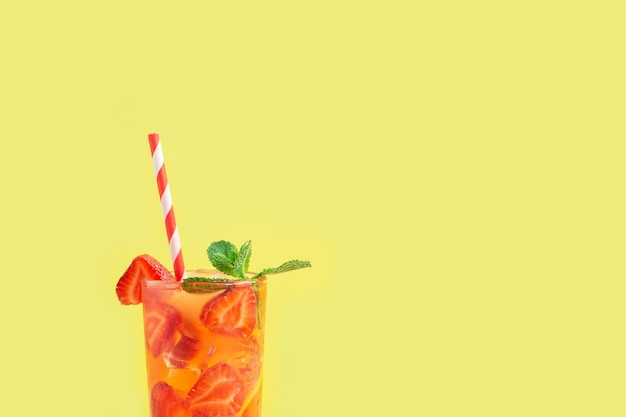 Cold strawberry lemonade juice with ice cubes and mint