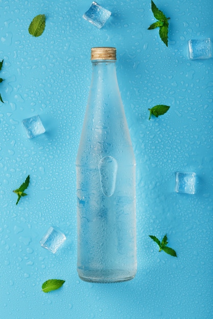 Cold Water Bottle, ice cubes, drops and mint leaves