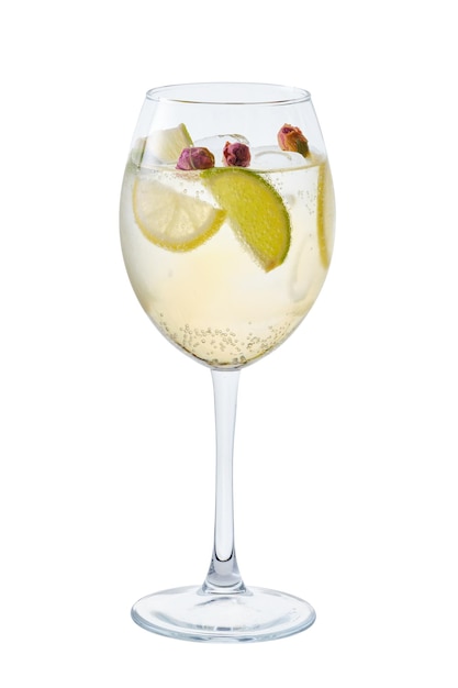 Cold white sangria with dry rosebuds in wine glass