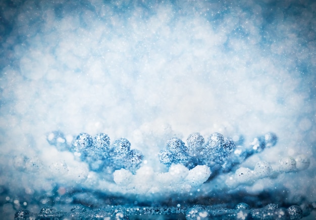 Photo cold winter glitter background with snowflake