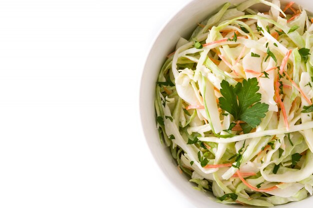 Coleslaw salad in white bowl isolated on white