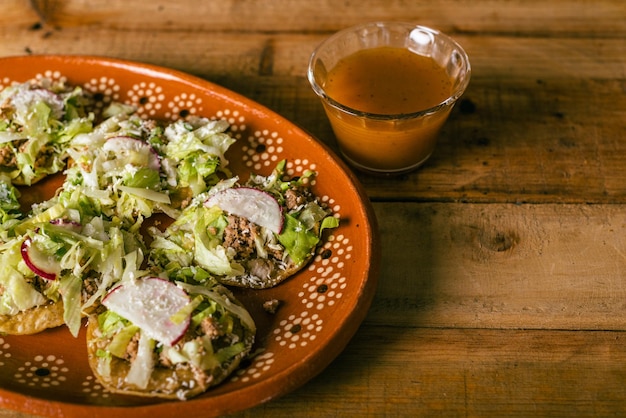 Colima style sopitos plate on wooden table Typical mexican food