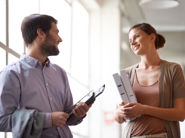 collaboration smile and tablet with business people talking in office for planning or strategy teamwork technology and conversation with employee people in workplace together for administration