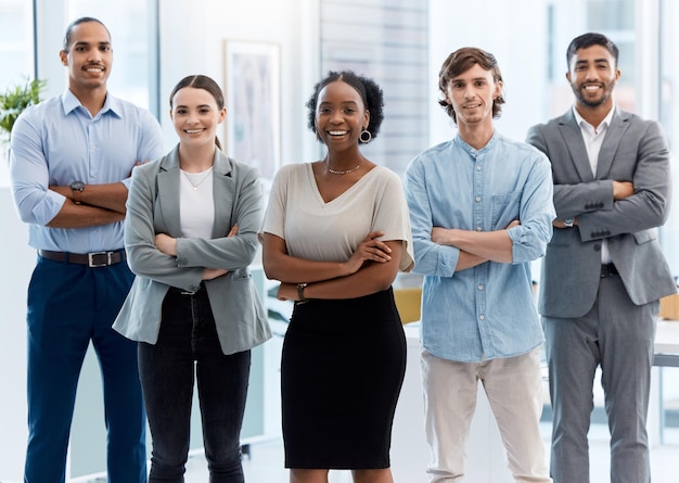 Photo collaboration teamwork and leadership with proud business partner standing in unity and power in an office portrait of smiling diverse team leader on a mission for success with goal and vision