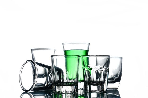 Collage of glasses with cocktail on a white background.