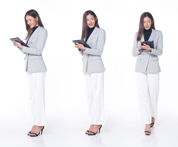 Collage Group Full length Figure snap of 20s Asian Woman brown hair business suit pant and high heels shoes. Female stands hold digital tablet check work social media over white Background isolated