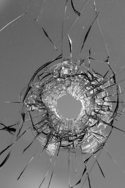 Collage Hole from a ball in the glass, cracks on a white background