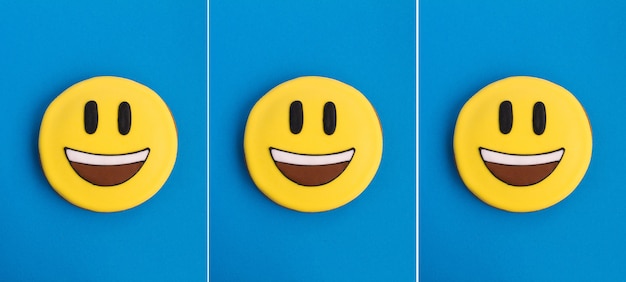 Foto collage di smiley sotto forma di pan di zenzero sullo sfondo blu. primo piano.