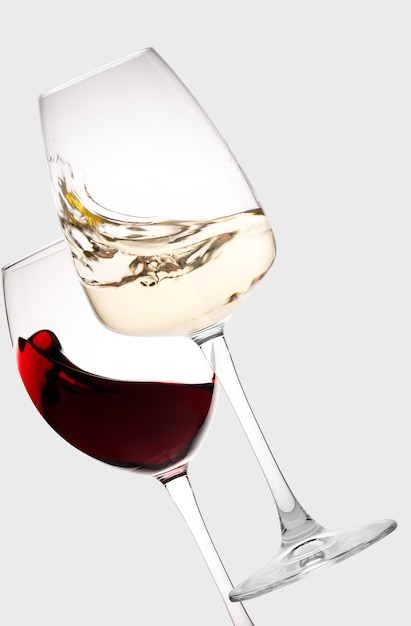 Collage of two glasses with red and white wine. Light background