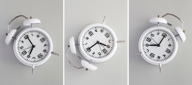 Collage of white alarm clock on the gray background Top view Closeup