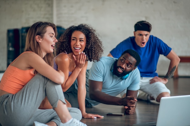 Colleagues discussing foreign dance videos from the internet