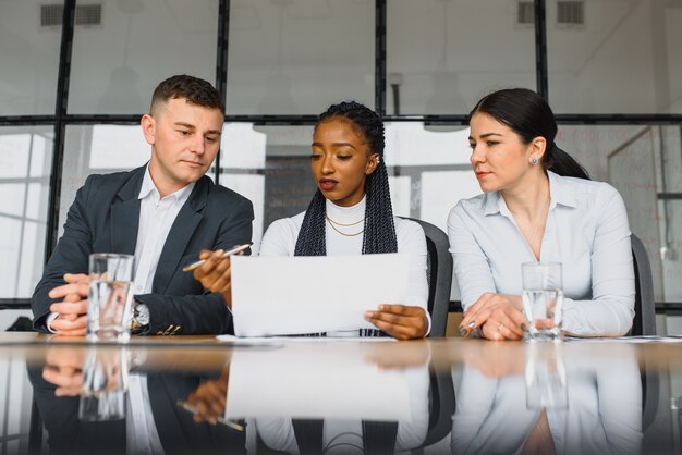 Colleagues discussing ideas in office