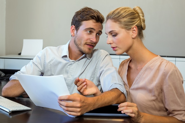 Colleagues discussing in office