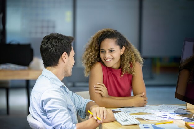 Colleagues Discussing In Office