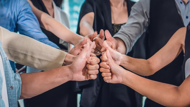 Colleagues gesturing while standing in office