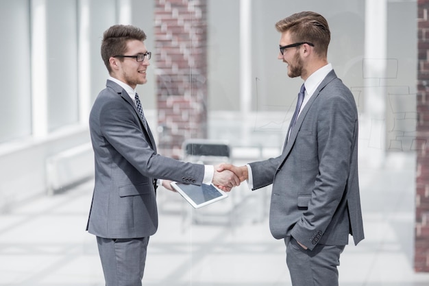 Colleagues greet each other with a handshakeconcept of partnership