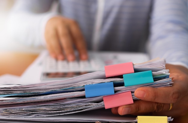colleagues submitted trade data chart document to each other business and office life concept