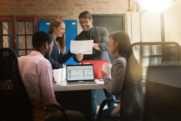 Colleagues working in modern office space