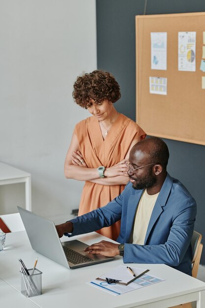 Colleagues working online on laptop