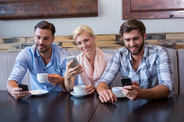 Colleagues working with smartphones