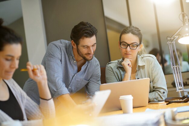 Colleagues workshopping business ideas in modern co working space