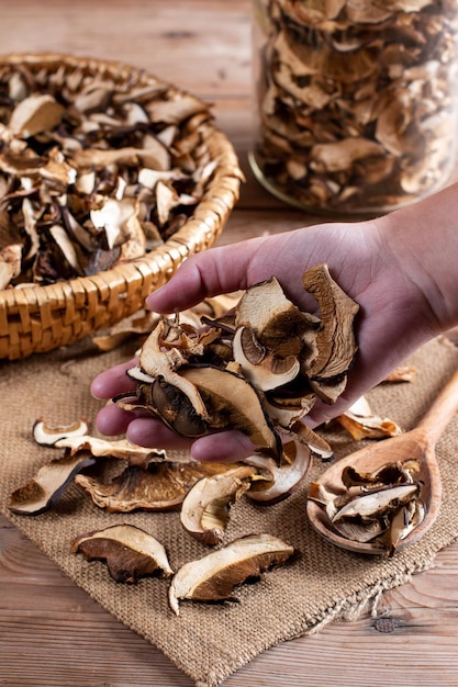 Collect and dry mushrooms in autumn porcini mushrooms a delicious ingredient for sauces and goulash on a wooden table